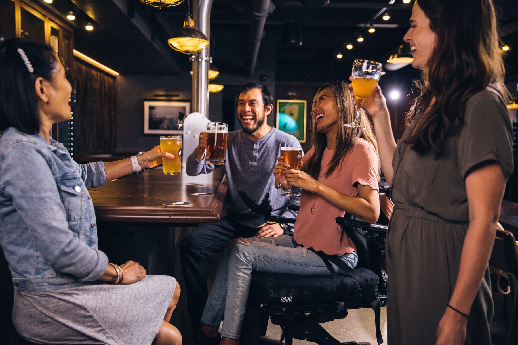 Friends drinking beer having fun bar