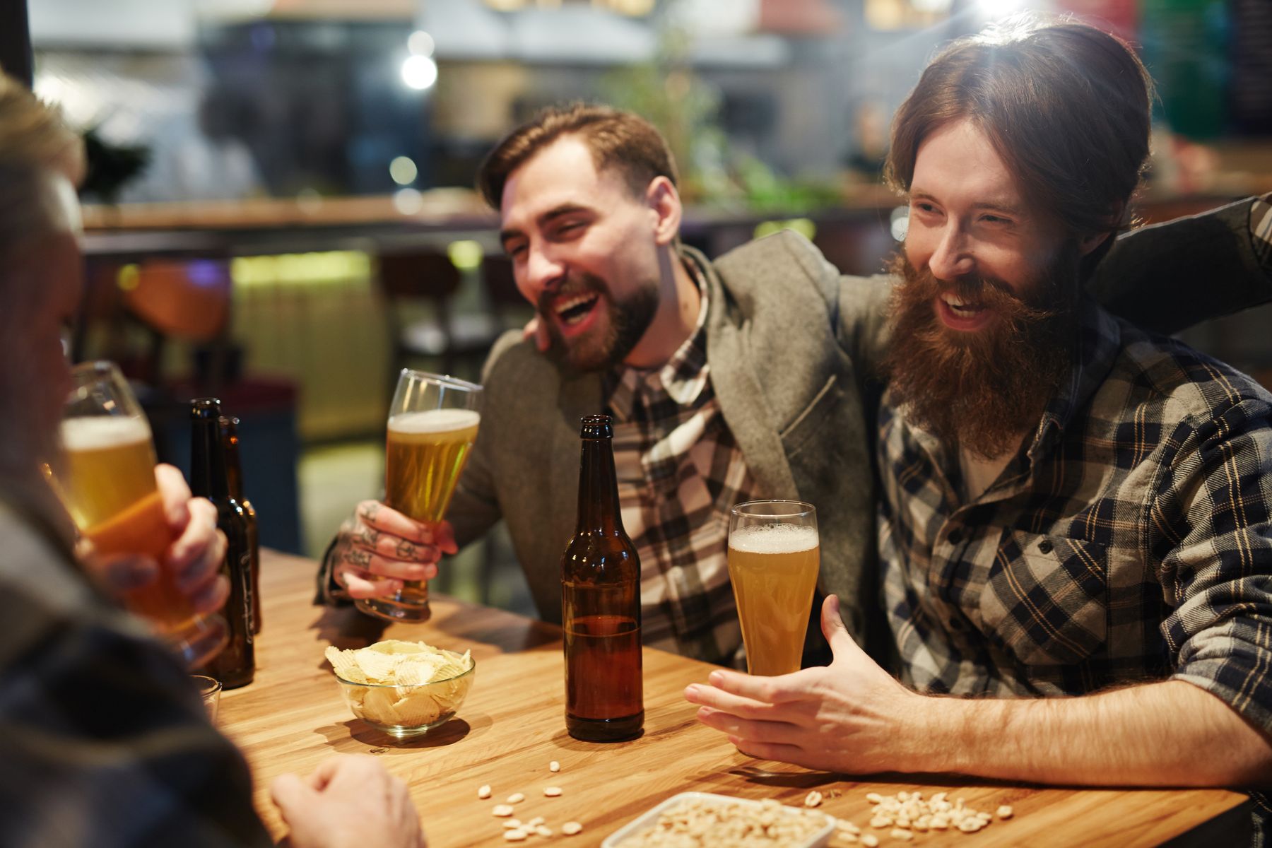 Stag do lads laughing drinking beer