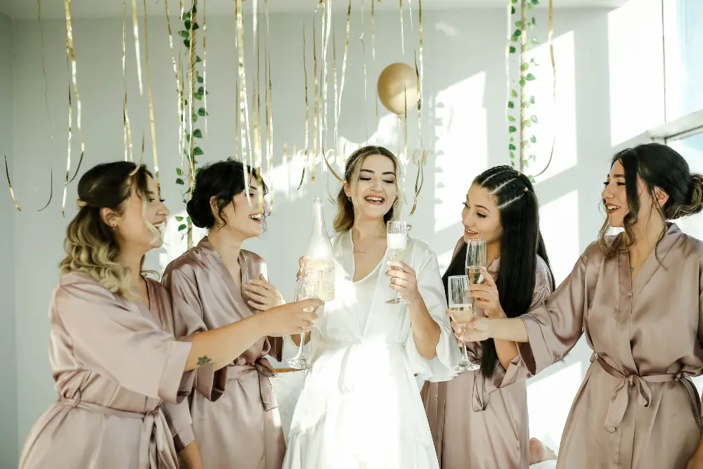 Hen party women celebrating champagne